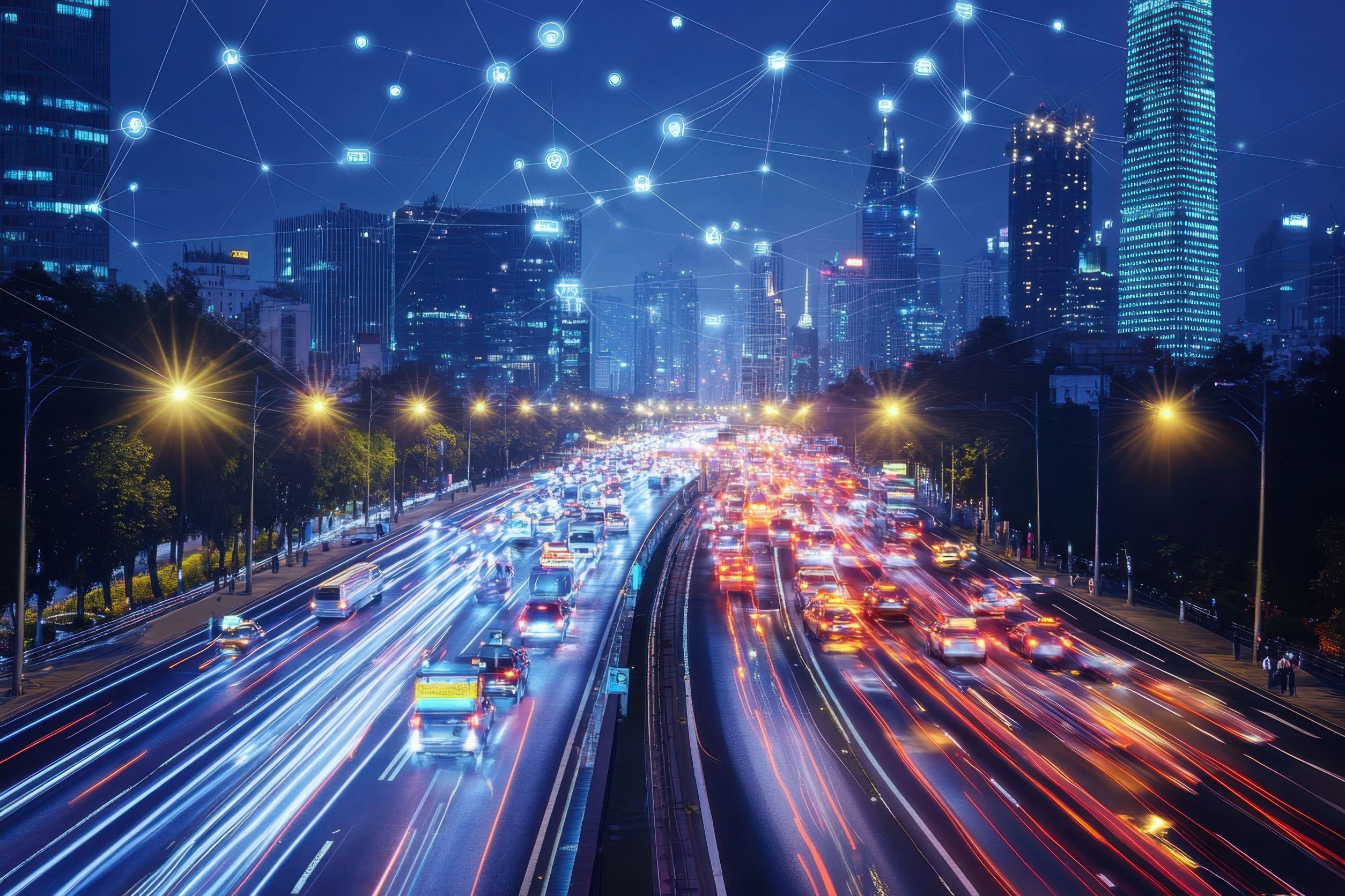 Bright lights from vehicles create trails on a busy highway surrounded by glowing city skyscrapers